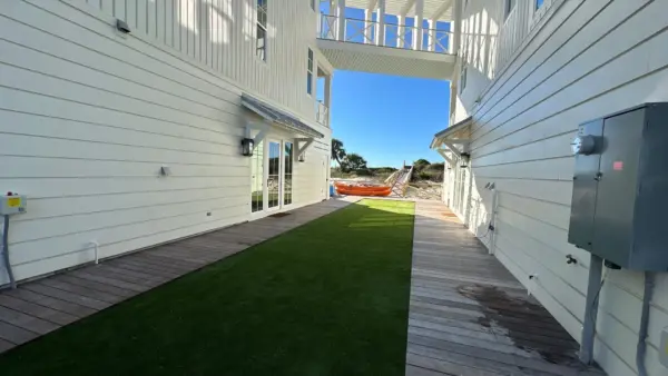 Large astroturf area added between gulf-front homes